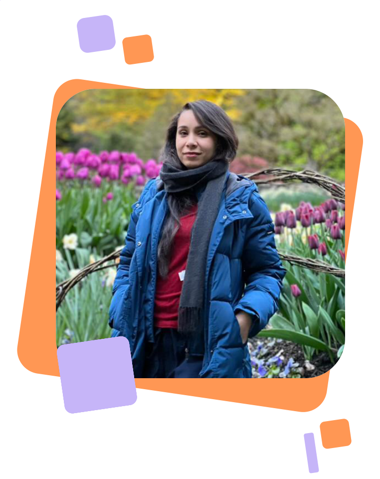 Maryam outdoors among flowers